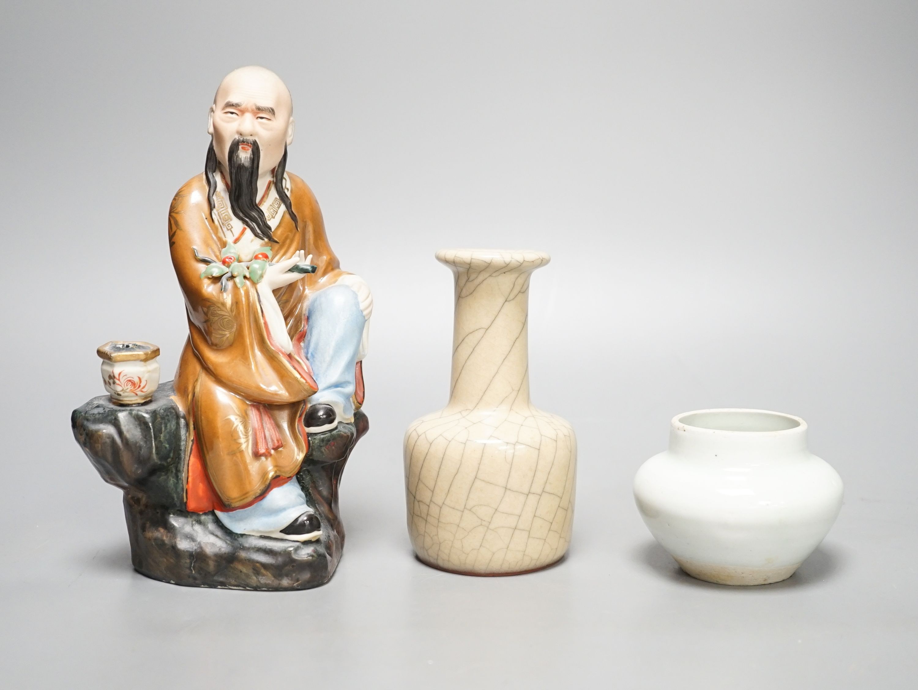 A Chinese porcelain figure, a crackleware jar and a monochrome water pot 20cm